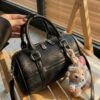 0aee9d5a-56c1-4b50-98ce-8f9cda9b7159-Max-Origin.jpg Textured Barrel Crossbody Bag
