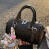 25adaa82-4ed2-43da-8fa1-46b20f15da17-Max-Origin.jpg Textured Barrel Crossbody Bag
