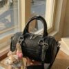 5aa4015a-1ecc-48e1-b014-cdde4f3f478a-Max-Origin.jpg Textured Barrel Crossbody Bag