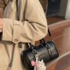 95449b6f1519441fa4e73239d2a4476d-Max-Origin.jpg Textured Barrel Crossbody Bag