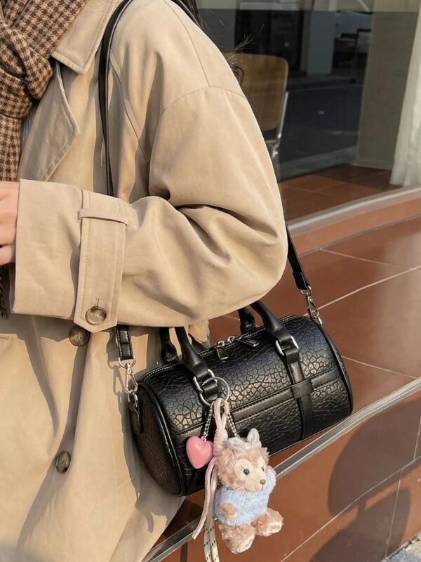 95449b6f1519441fa4e73239d2a4476d-Max-Origin.jpg Textured Barrel Crossbody Bag