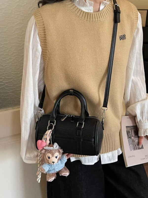 985f8d5ec3484a29b4eb10c547d21049-Max-Origin.jpg Textured Barrel Crossbody Bag